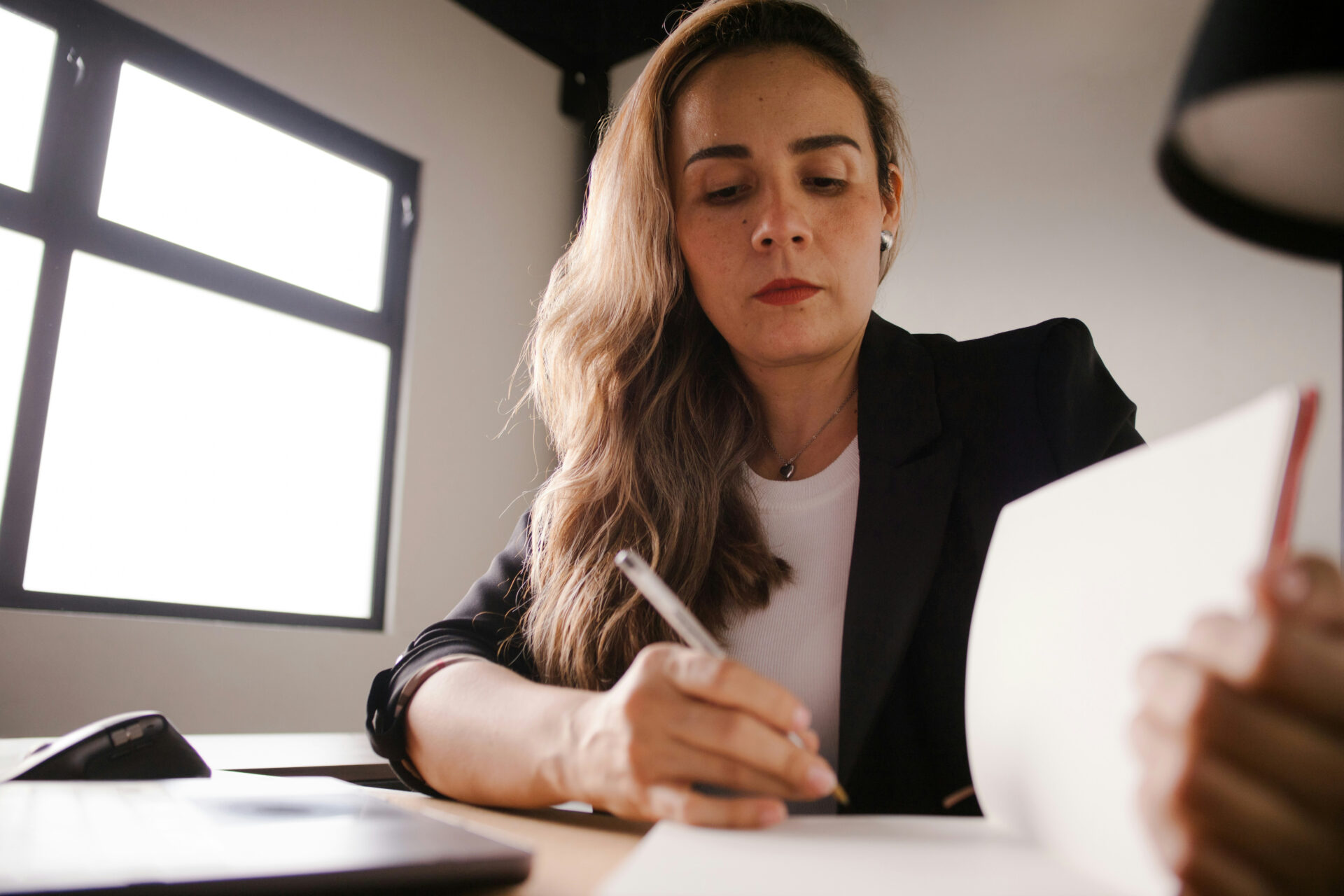 woman writing in notebook picture
