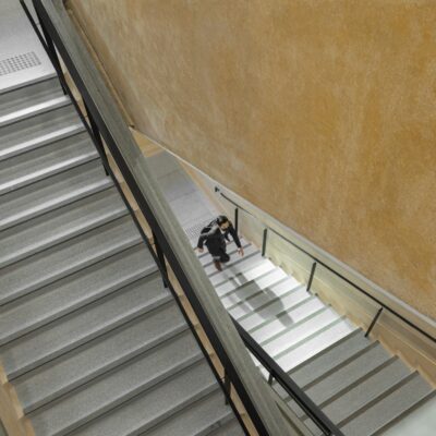 man walking up stairwell picture