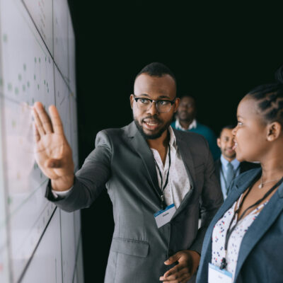 man presenting at board picture