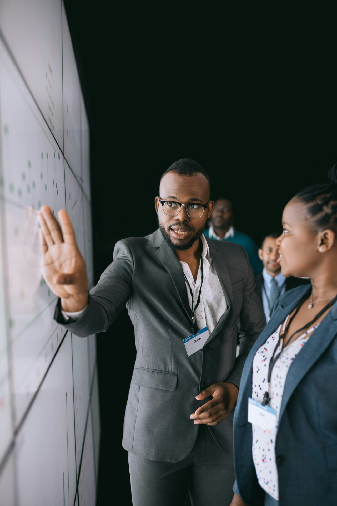 man presenting at board picture