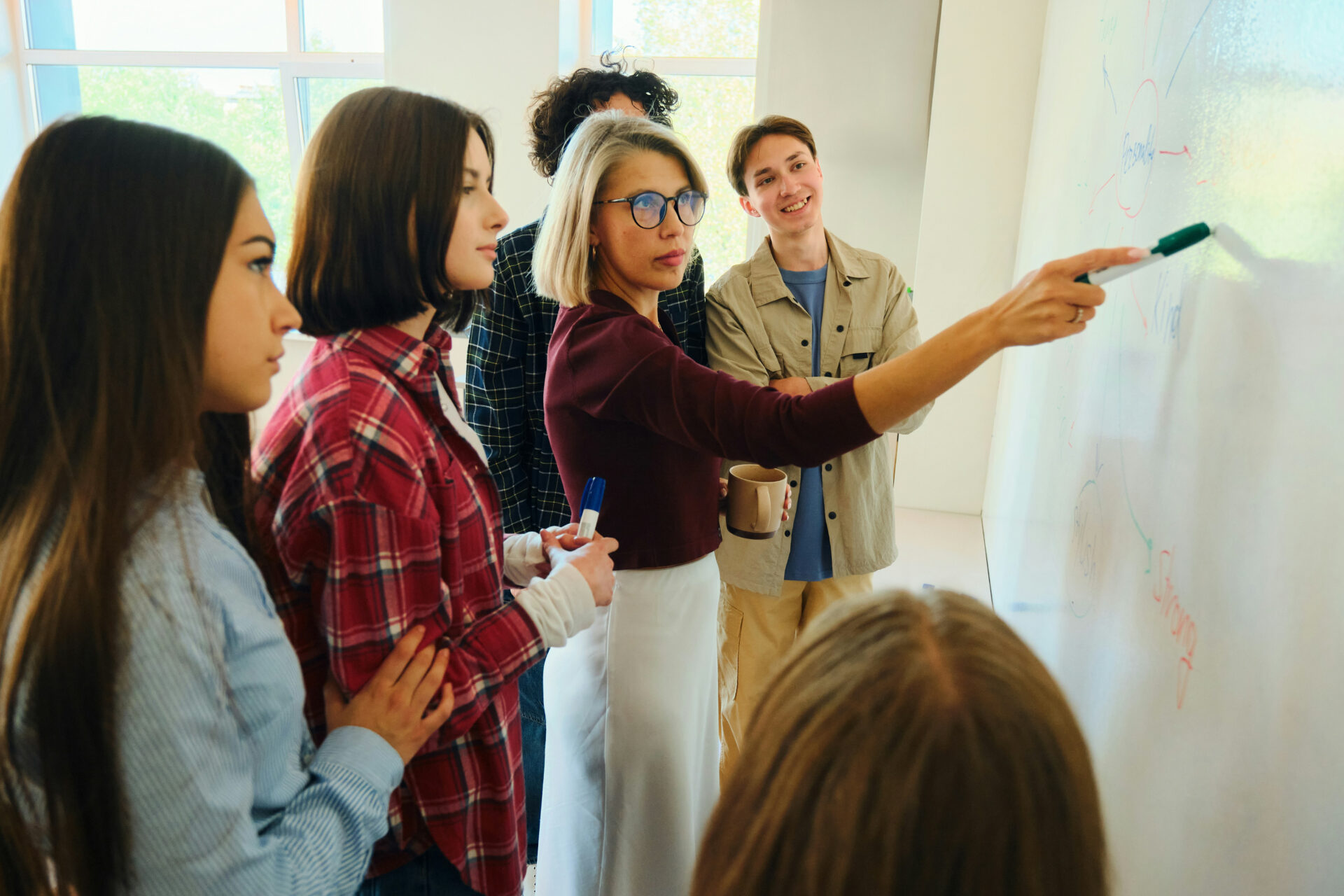woman teaching at whiteboard picture